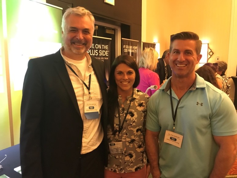 Hans Eng, Joey Reed, and Chris Dodson pose together for a picture the HBOT 2019 conference for hyperbaric oxygen therapy